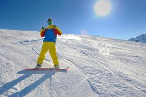 skiing on fresh snow at winter season at beautiful sunny day photo