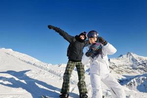 winter portrait of friends at skiing photo