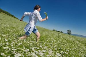 Young happy woman in green field photo