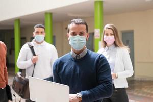 Multiethnic students group wearing protective face mask photo