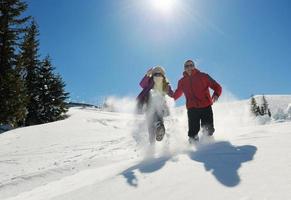 young couple on winter vacation photo