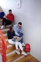students use modern technology in school to create projects photo