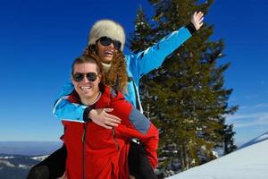 young couple on winter vacation photo