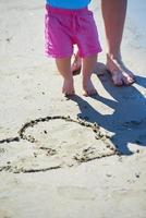 mom and baby on beach  have fun photo