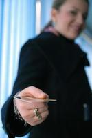 Businesswoman holding credit card photo