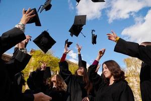 Group of diverse international graduating students celebrating photo