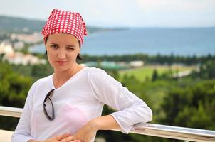 Young pretty woman enjoying the sun photo