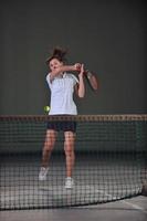 Playing tennis indoors photo