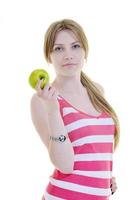 happy  young  woman eat green apple isolated  on white photo