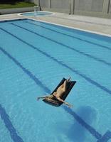 beautiful woman relax on swimming pool photo