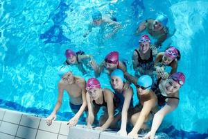 happy children group  at swimming pool photo