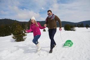 happy young couple having fun on fresh show on winter vacation photo