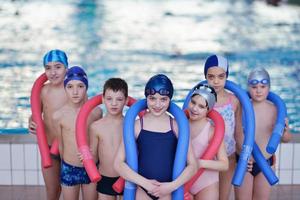 happy children group  at swimming pool photo