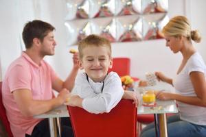 family have healthy breakfast at home photo