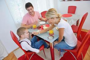 family have healthy breakfast at home photo