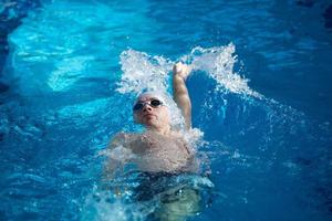 swimmer excercise on indoor swimming poo photo