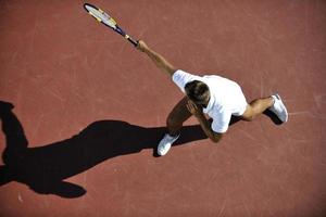 young man play tennis photo