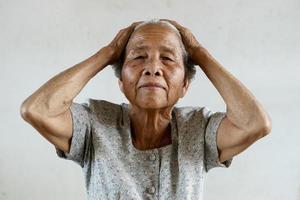 Senior asian woman was headache photo