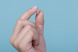 Child's hand holding first tooth milk, Dentistry and Health care concept photo