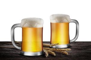 Two Glasses of Light Beer with wheat on the wooden table isolate white background, with copy space for your text photo