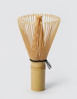 Japanese wire whisk made by bamboo on white background photo