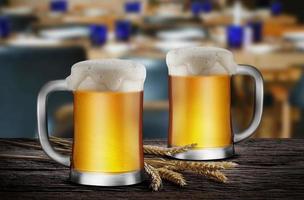 Two Glasses of Light Beer with wheat on the wooden table in the restaurant, with copy space for your text photo