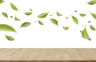 Flying whirl green leaves in the air with wooden table, Healthy products by organic natural ingredients concept, Empty space in studio shot isolated on white background long banner photo