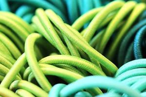 Detailed close up view on samples of cloth and fabrics in different colors found at a fabrics market photo