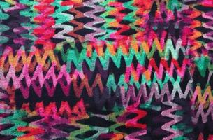 Detailed close up view on samples of cloth and fabrics in different colors found at a fabrics market photo