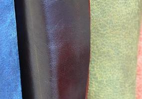 Detailed close up view on samples of cloth and fabrics in different colors found at a fabrics market photo