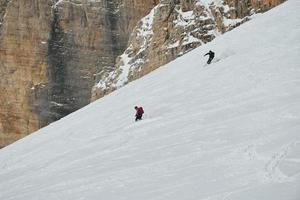 Skiers on mountain photo