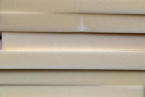 Detailed close up view on samples of cloth and fabrics in different colors found at a fabrics market photo