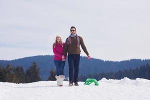 happy young couple having fun on fresh show on winter vacation photo