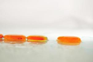 isolated wet zen stones with splashing  water drops photo