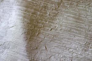 Detailed close up view on samples of cloth and fabrics in different colors found at a fabrics market photo