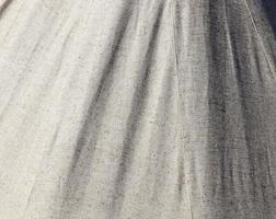 Detailed close up view on samples of cloth and fabrics in different colors found at a fabrics market photo