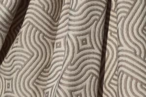 Detailed close up view on samples of cloth and fabrics in different colors found at a fabrics market photo