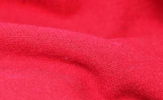 Detailed close up view on samples of cloth and fabrics in different colors found at a fabrics market photo