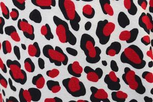 Detailed close up view on samples of cloth and fabrics in different colors found at a fabrics market photo