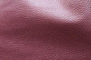 Detailed close up view on samples of cloth and fabrics in different colors found at a fabrics market photo