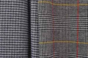 Detailed close up view on samples of cloth and fabrics in different colors found at a fabrics market photo