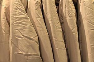Detailed close up view on samples of cloth and fabrics in different colors found at a fabrics market photo