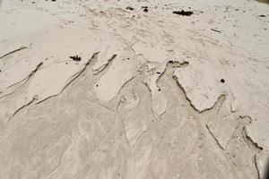 Beautiful shots of the white beach sand on the Seychelles paradise island with footprints photo