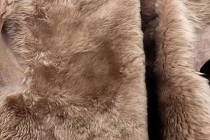 Detailed close up view on samples of cloth and fabrics in different colors found at a fabrics market photo