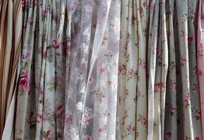 Detailed close up view on samples of cloth and fabrics in different colors found at a fabrics market photo