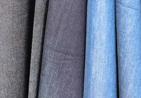 Detailed close up view on samples of cloth and fabrics in different colors found at a fabrics market photo