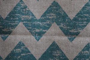 Detailed close up view on samples of cloth and fabrics in different colors found at a fabrics market photo