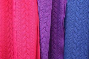 Detailed close up view on samples of cloth and fabrics in different colors found at a fabrics market photo