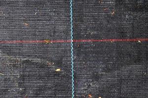 Detailed close up view on samples of cloth and fabrics in different colors found at a fabrics market photo