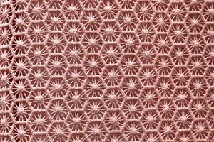 Detailed close up view on samples of cloth and fabrics in different colors found at a fabrics market photo